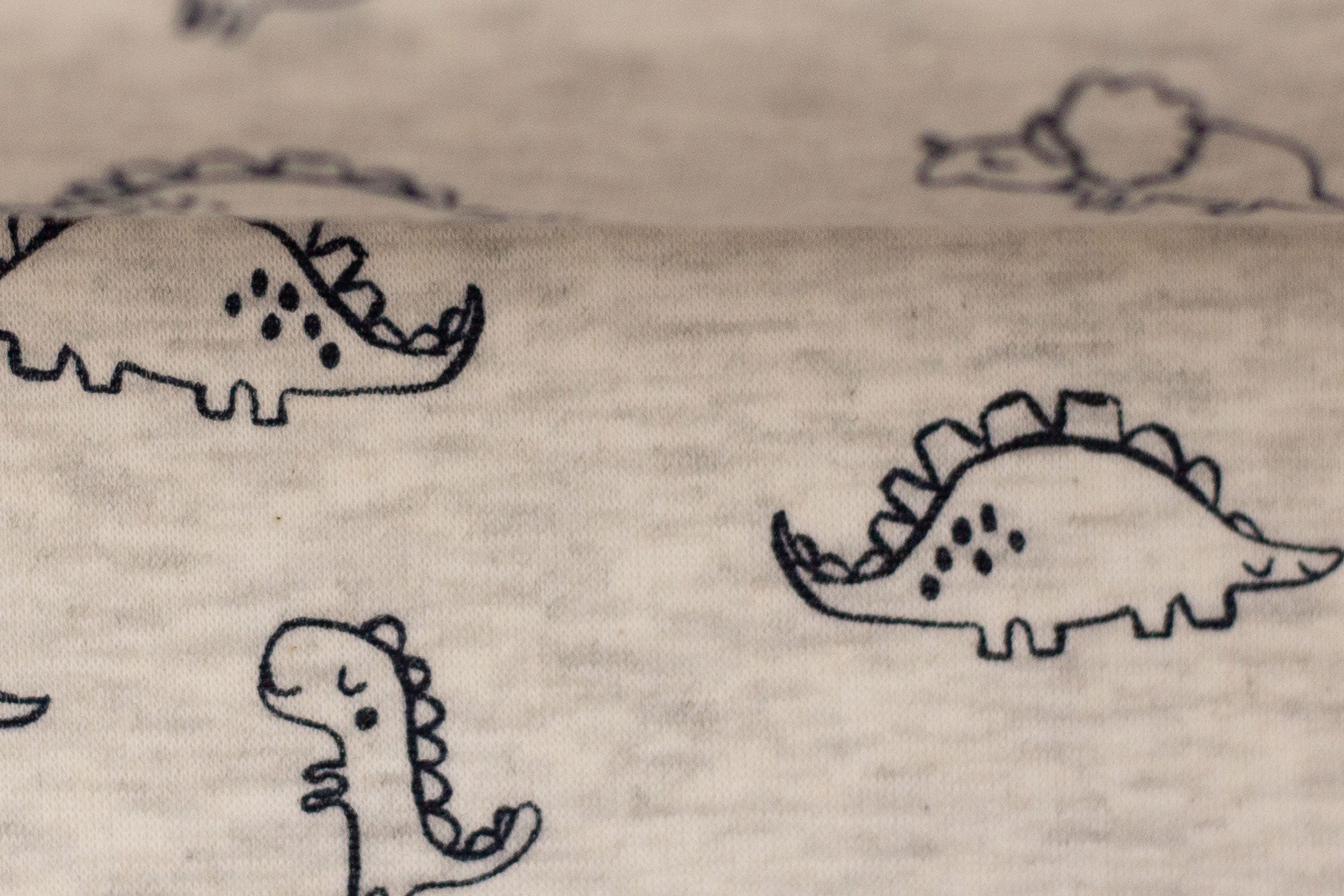 Alpenfleece meliert Oatmeal "Dinos" 0,5 m
