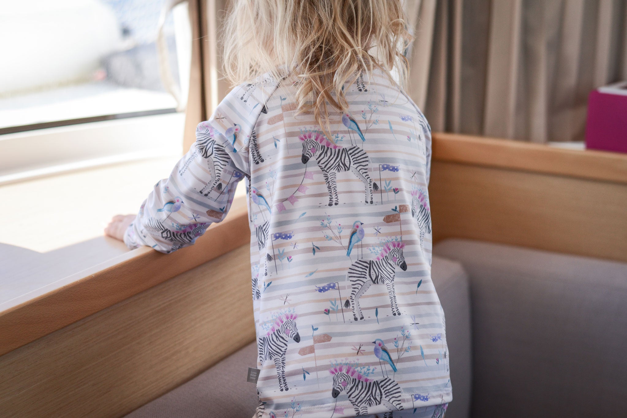 Lycra "Gabelracke und Zebra" pastel 0,5 m