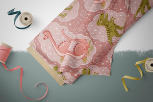 BIO French Terry "Happy Dinos" rosa 0,5 m